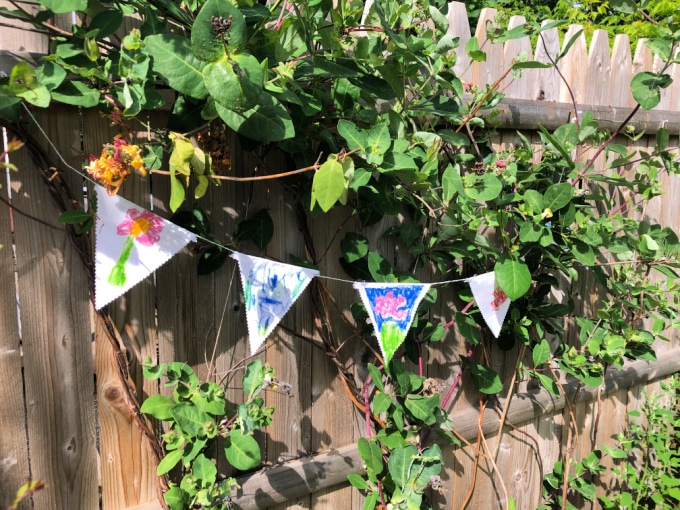 flags against fence_andrea martelle