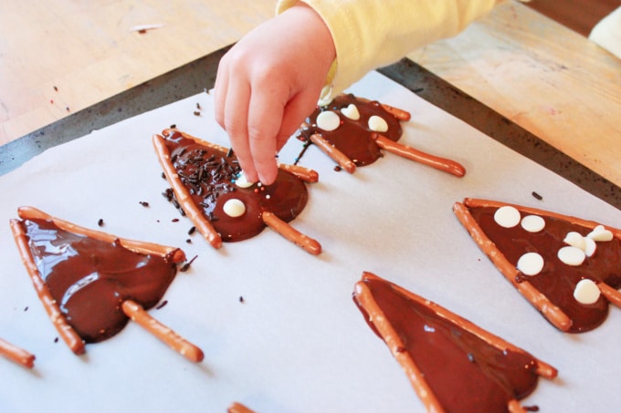 adding sprinkles to pretzel trees