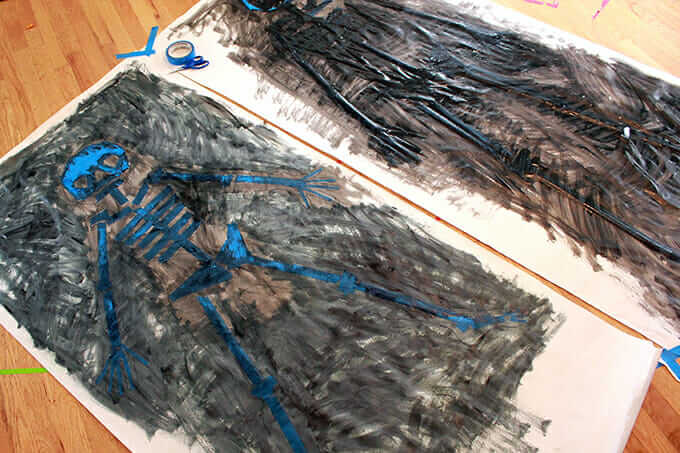 Tape Resist Skeleton Paintings – paint over skeletons