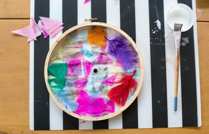 Tissue paper suncatchers in embroidery hoop frames