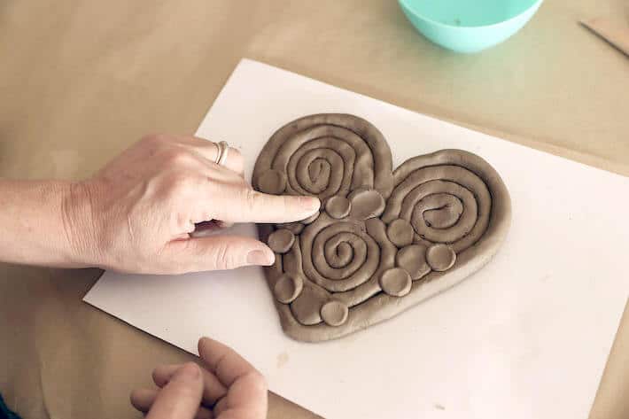 Adding finishing touches to Clay Coil Heart