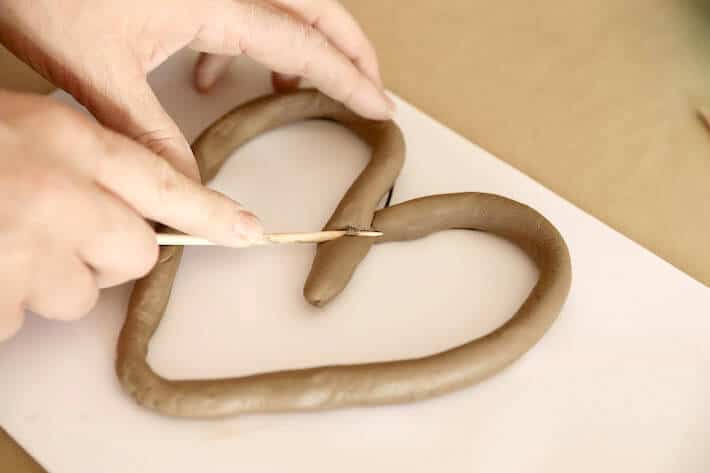 Cutting excess off of Clay Coil Hearts