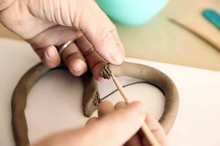 Scoring ends of Clay Coil Hearts