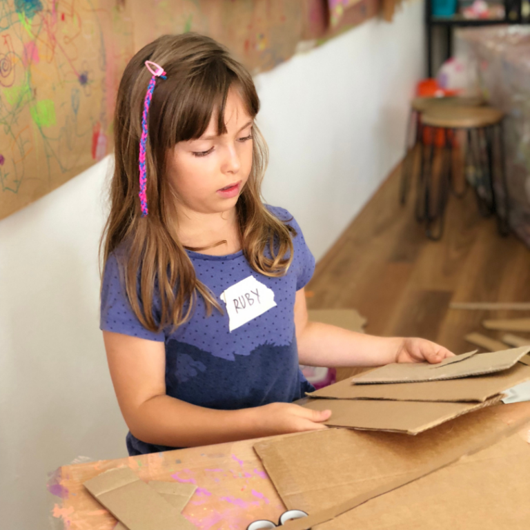 child with cardboard