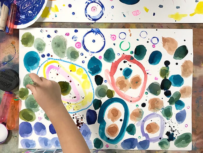 Child painting Yayoi Kusama Inspired Dot Paintings for Kids