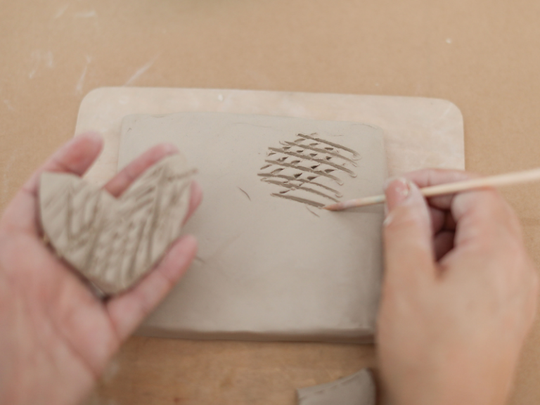 scoring in clay