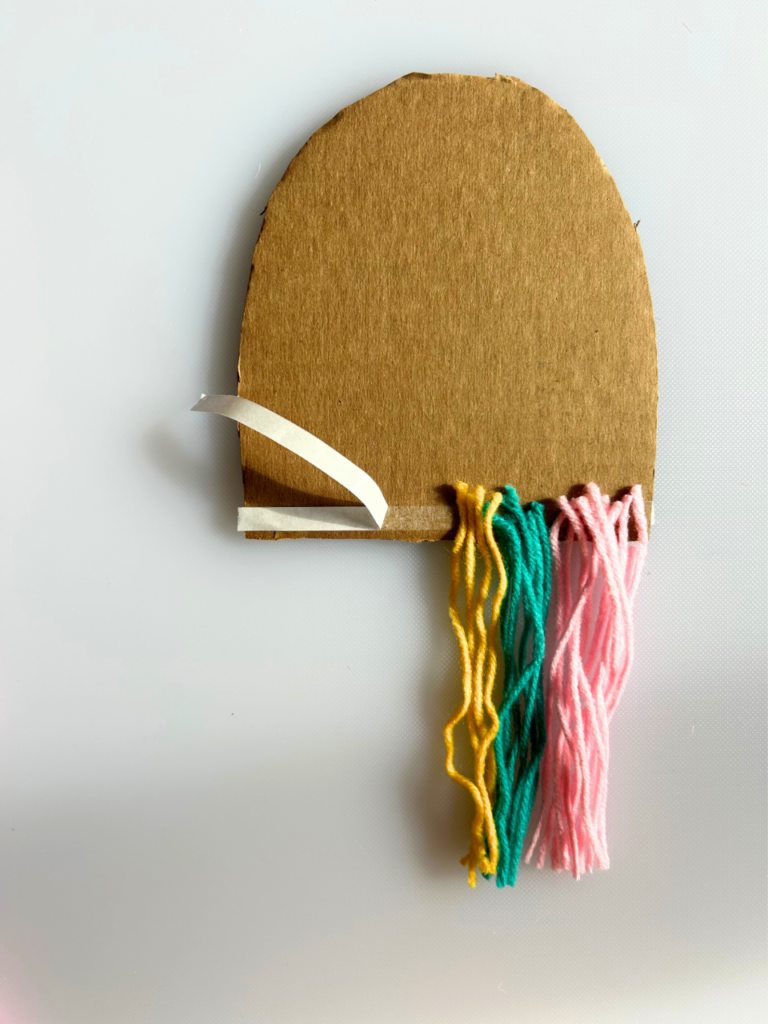attaching yarn to cardboard