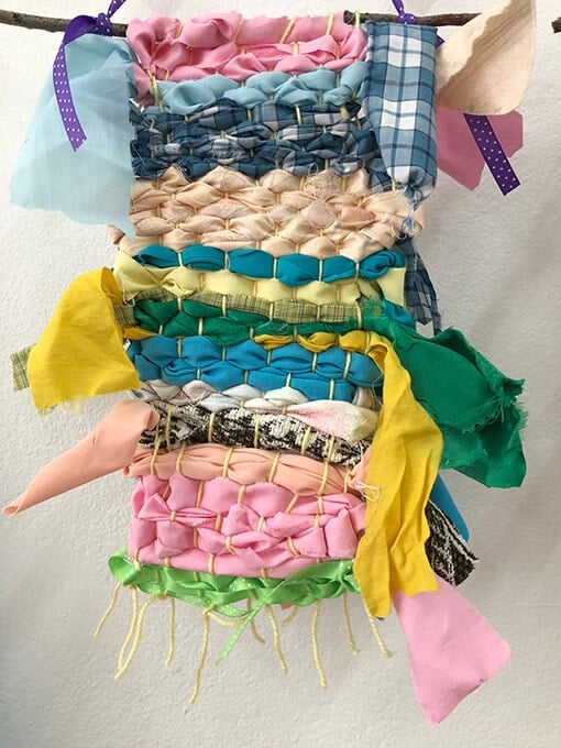 Beautiful fabric and ribbon weaving for kids on a cardboard loom