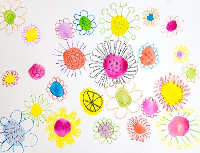 Painted watercolor doodle flowers on white paper