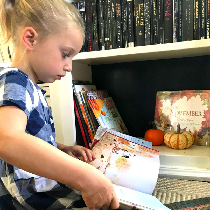 child reading book