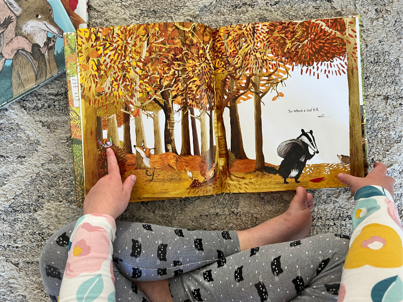 child reading fall book
