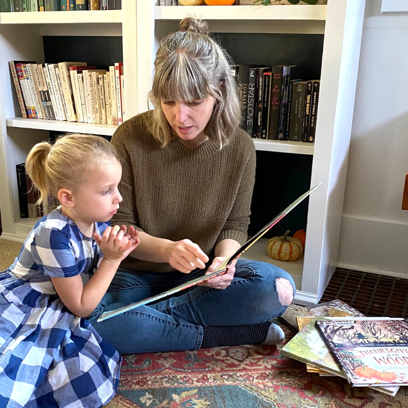 mother and child reading together