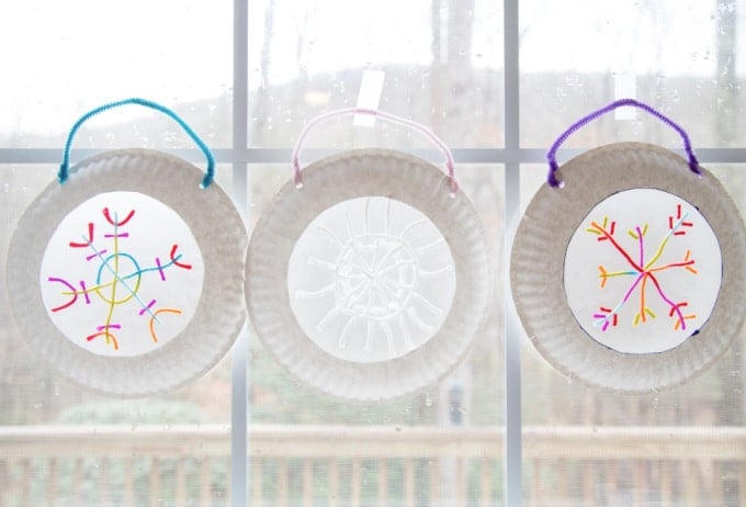 3 snow flakes in window