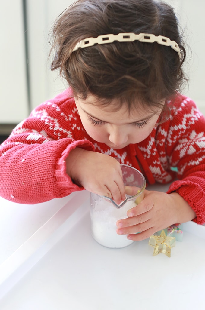 Child touching instant snow