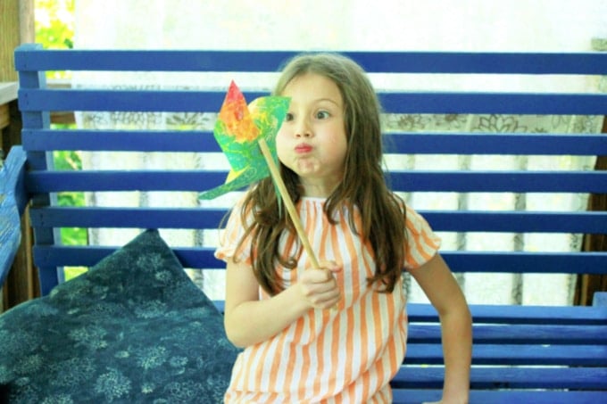 blowing a pinwheel