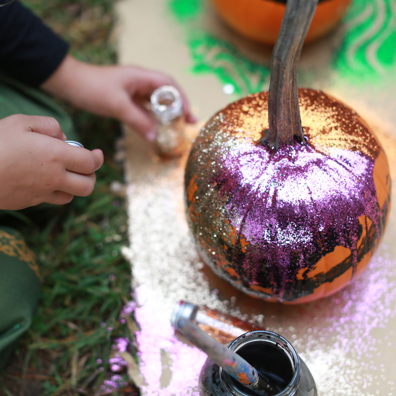 glitter and paint on pumpkins