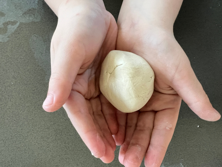 ball of clay in hands