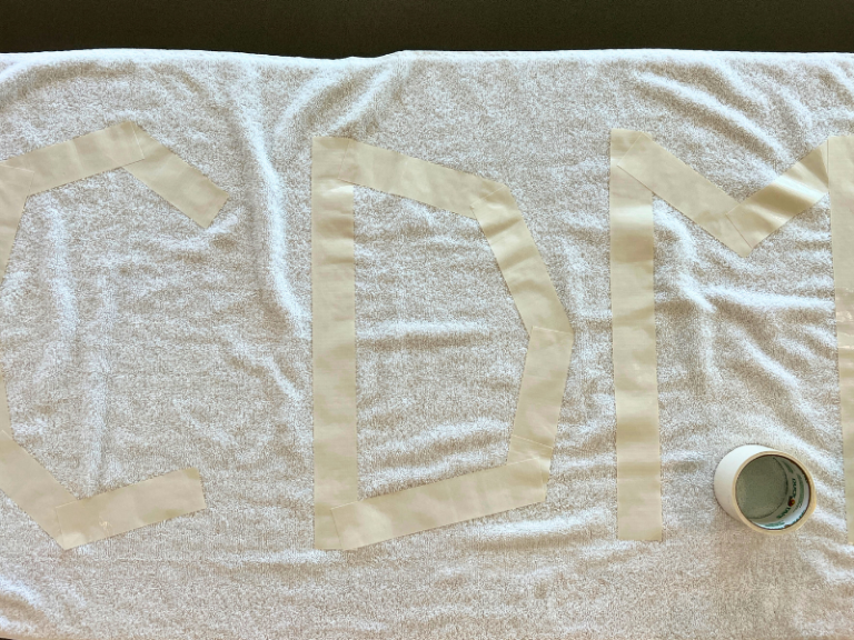 taping towel to dye