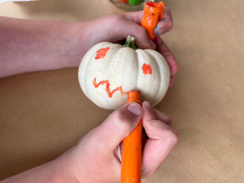 decorating pumpkin with paint stick