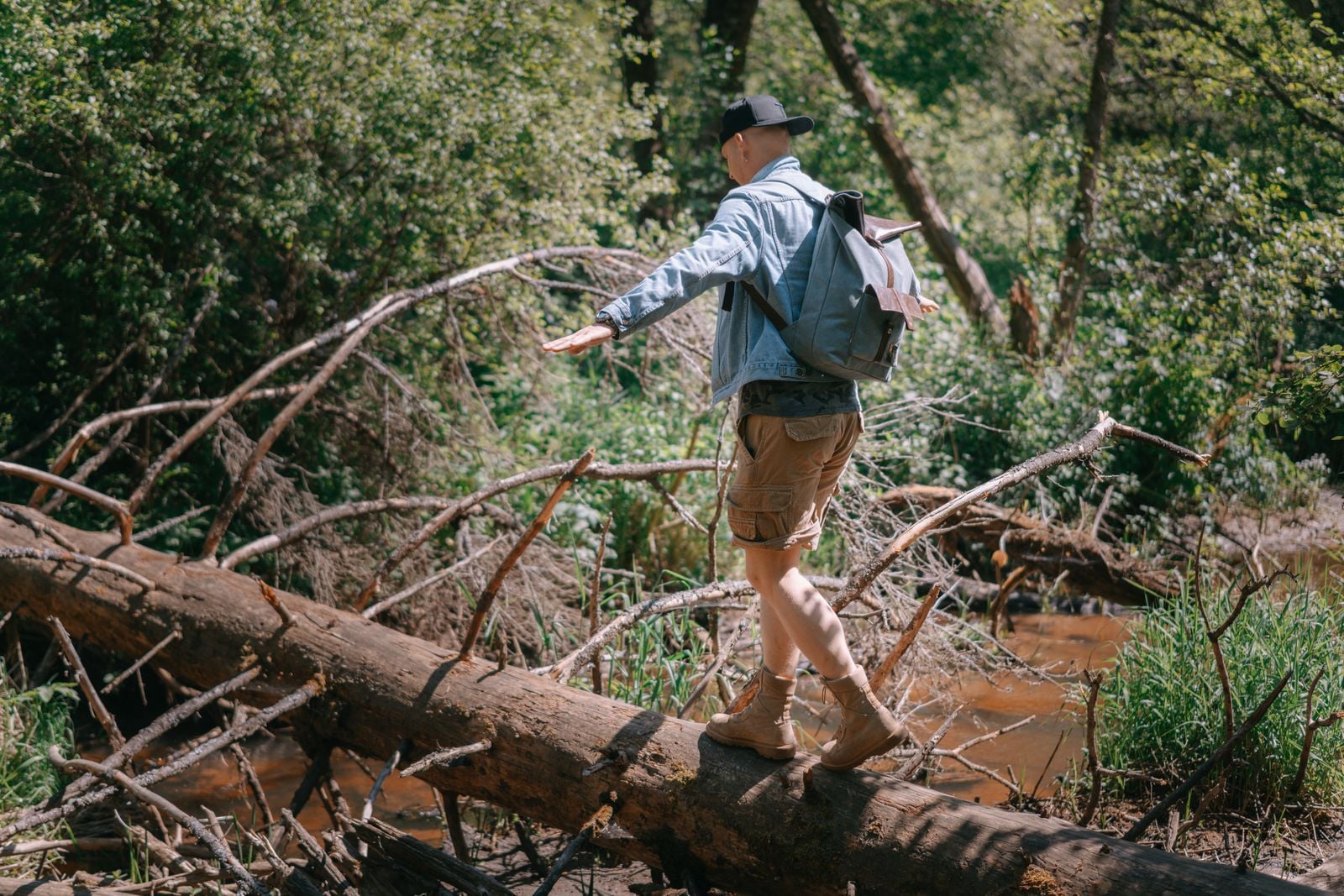 child balancing forest log