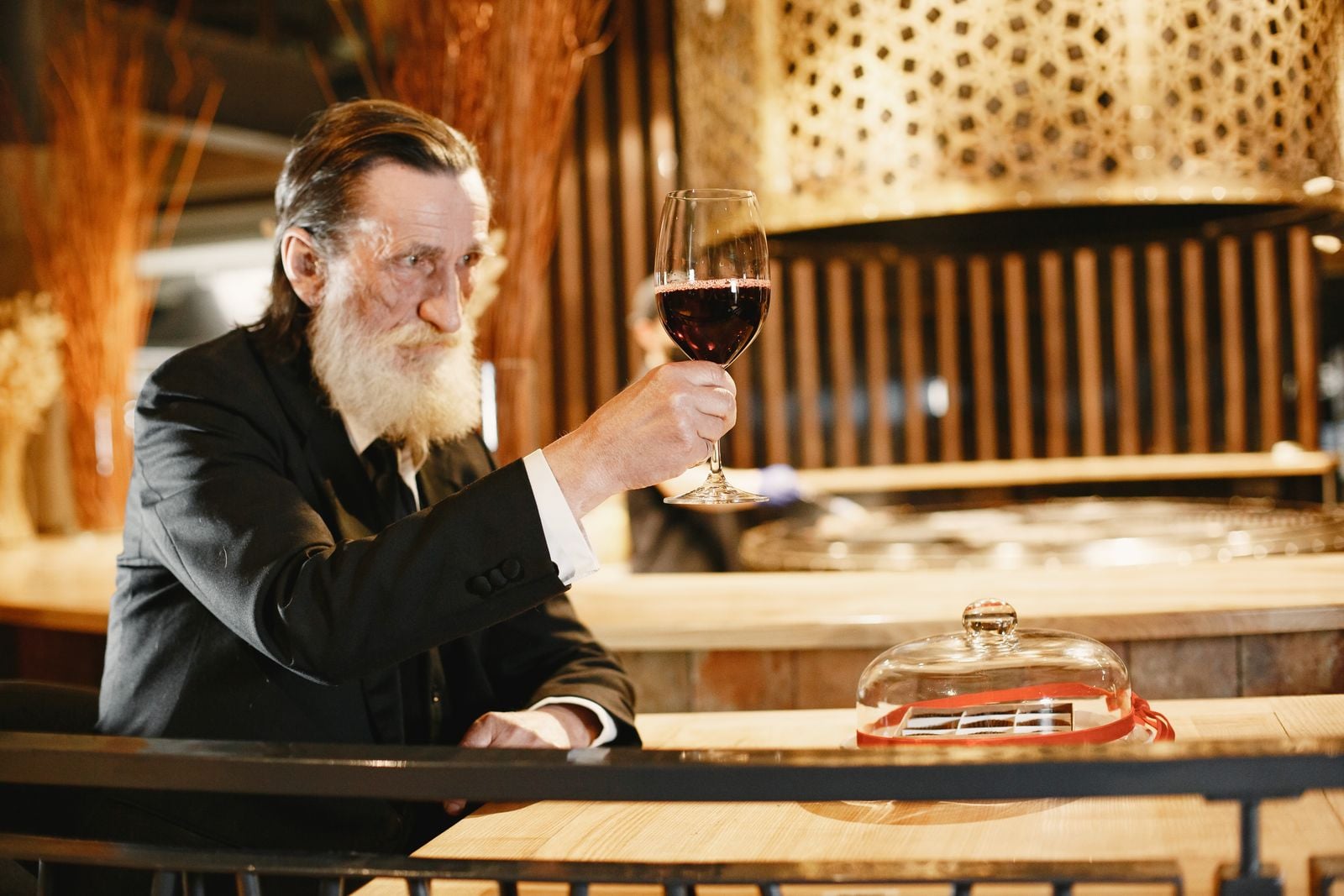 older man reading menu