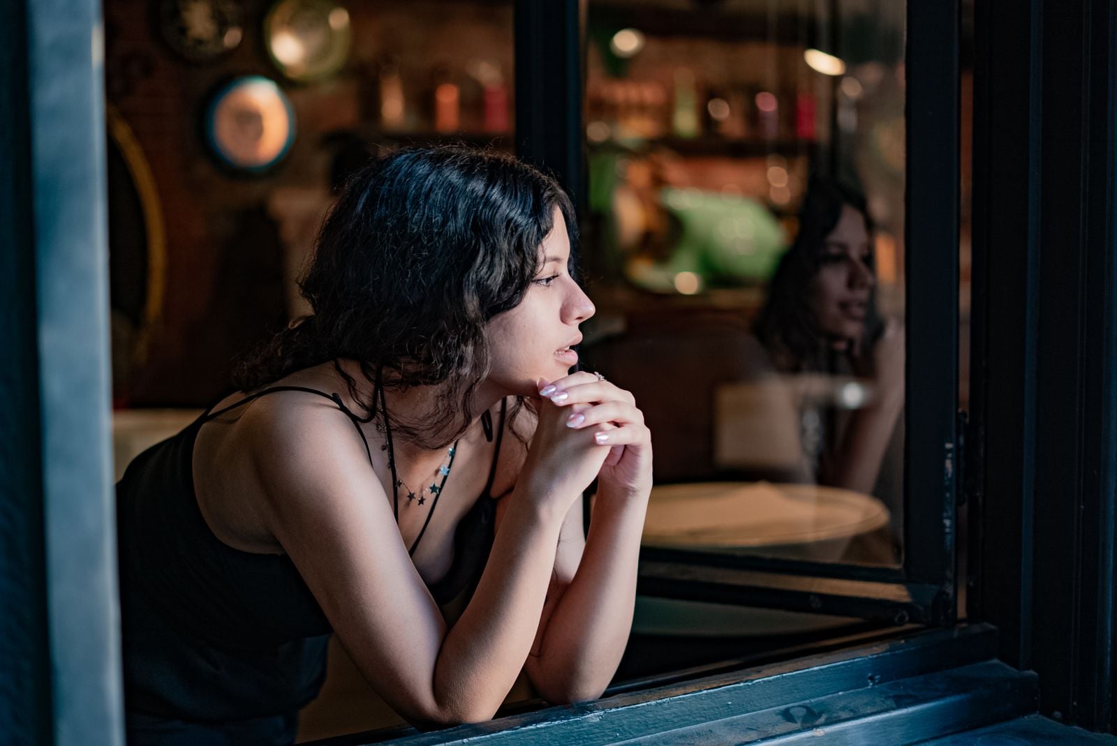 woman looking out window