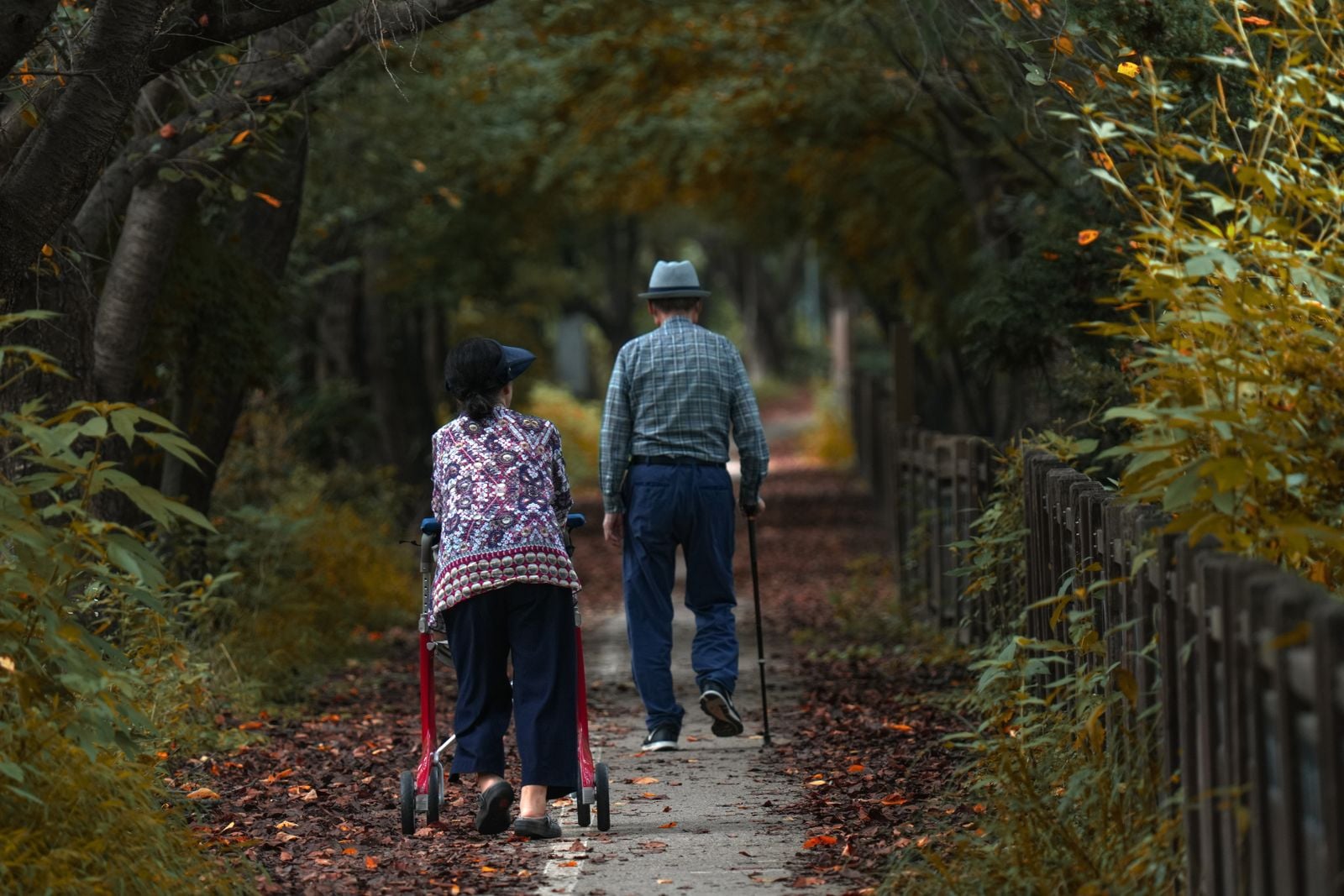 older man walking outdoors